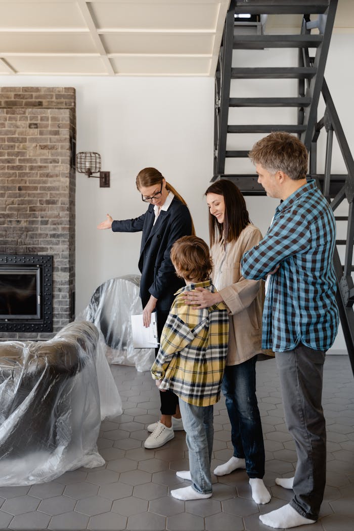 The Art of Drawing Readers In: Your attractive post title goes here A family tours a new home with a real estate agent, discussing property details.